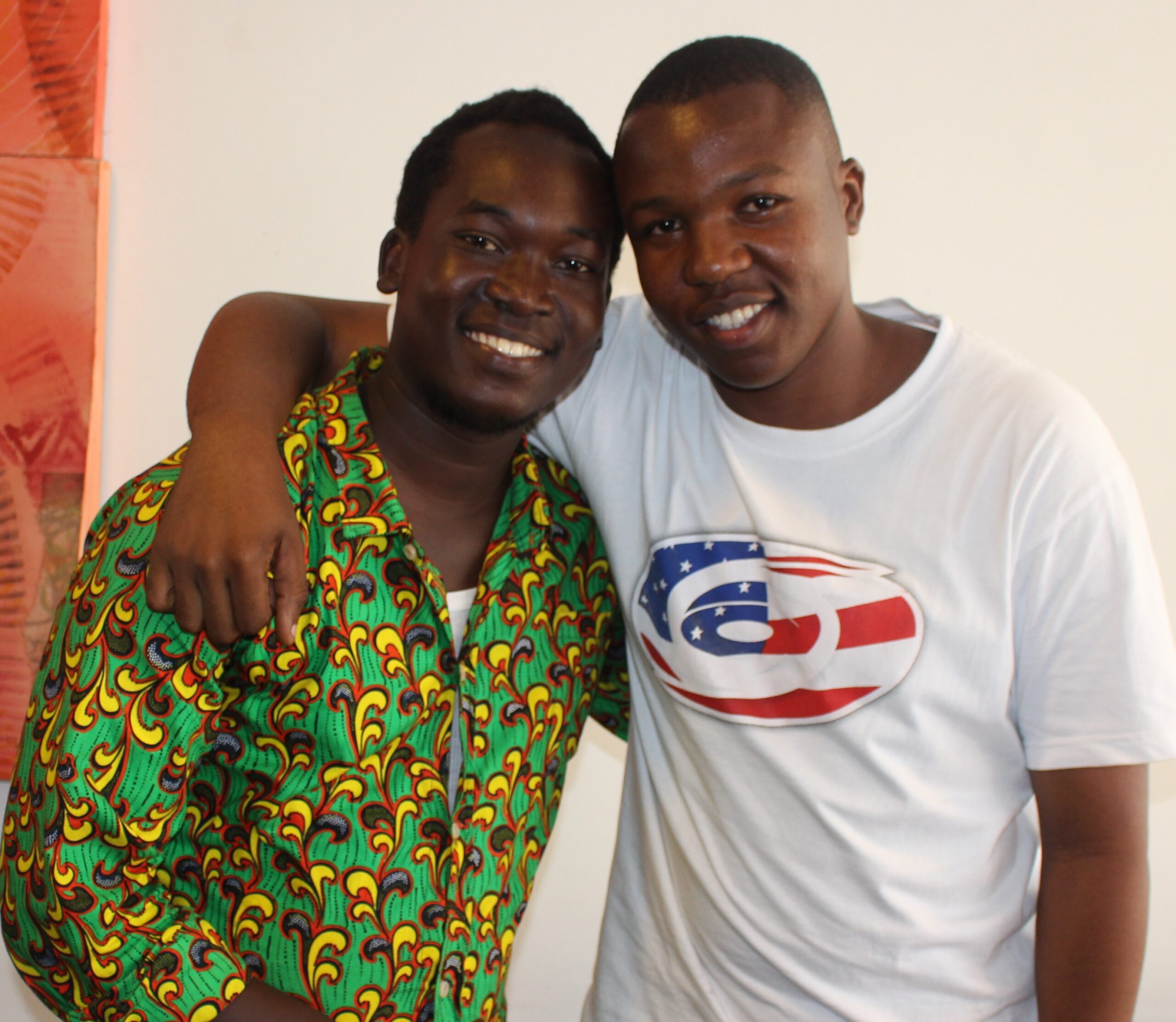 Two A young Tanzanian men smiling at the camera